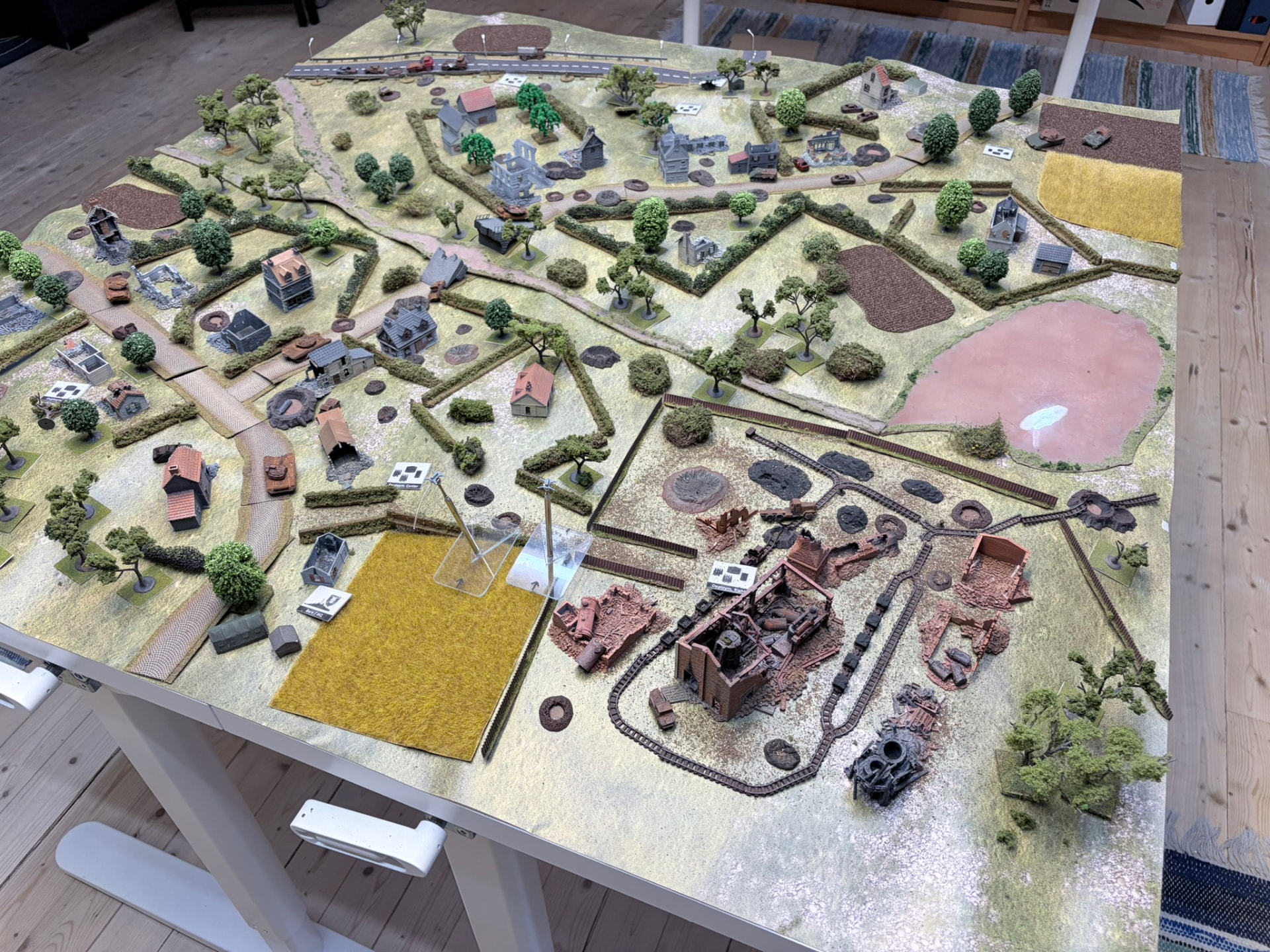 Full 10 mm Skirmish table: hedgerows, villages, a wrecked rail yard and drones on flight stands